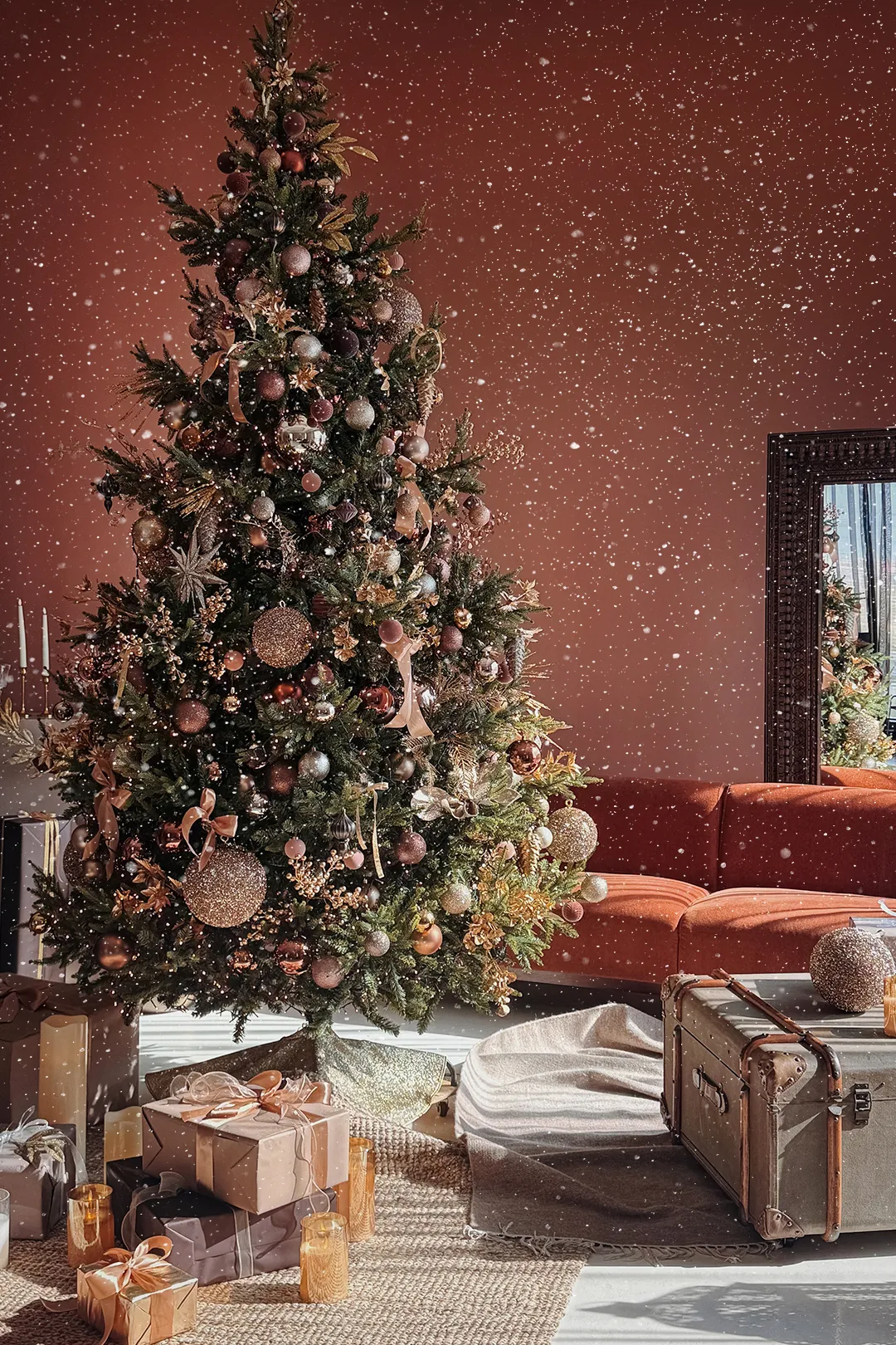 Decorated Christmas tree, wrapped gifts and a terracotta sofa in a festive photo set at Luma Studio Dubai.
